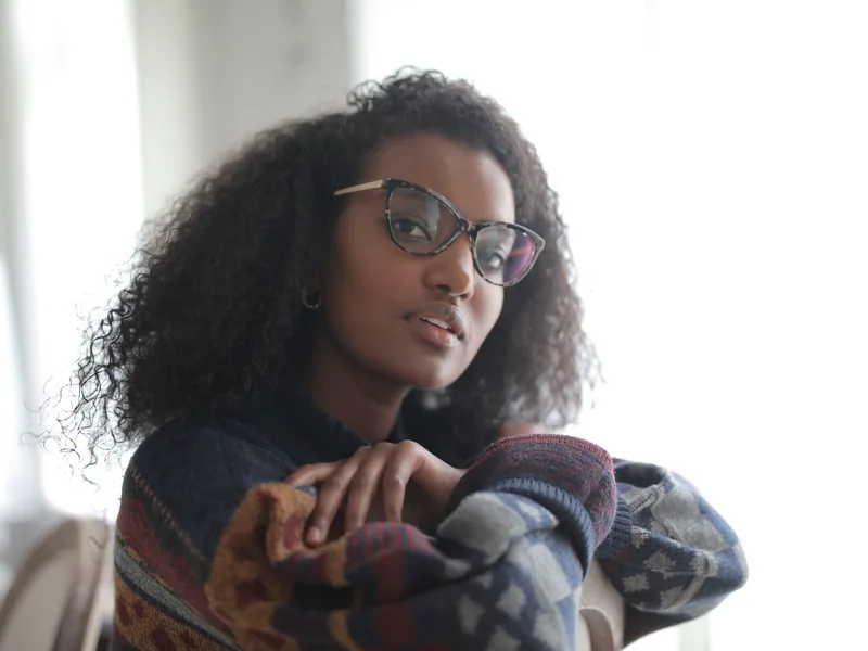 A woman wearing her glasses