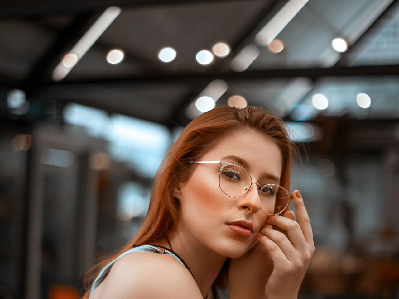 A woman wearing her glasses