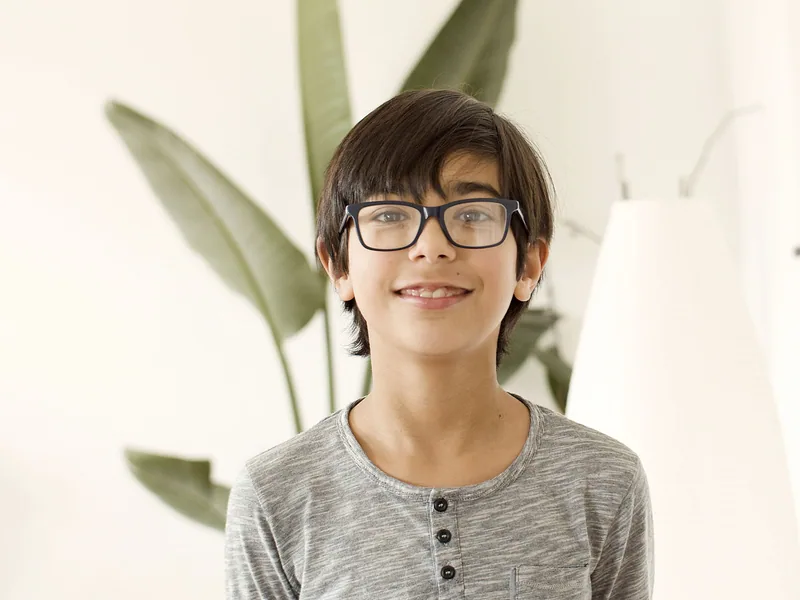 A boy wearing glasses