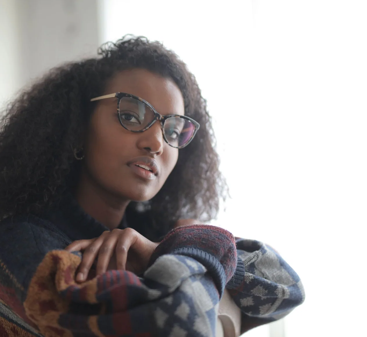 A woman wearing her glasses