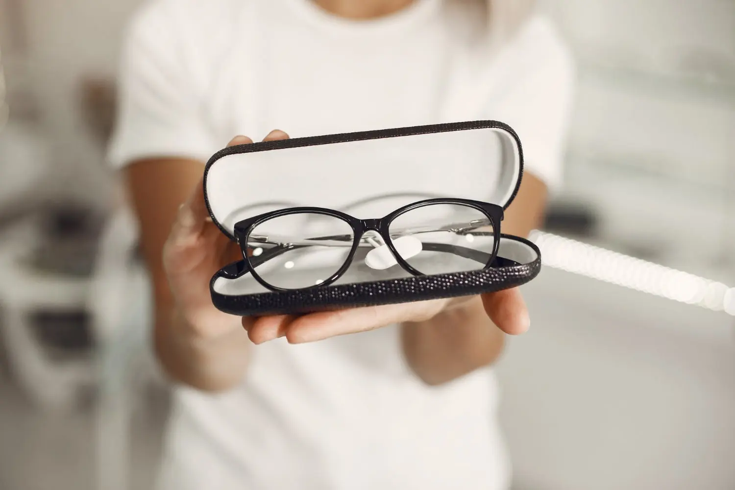 Glasses in their case, handed over at Little Optics
